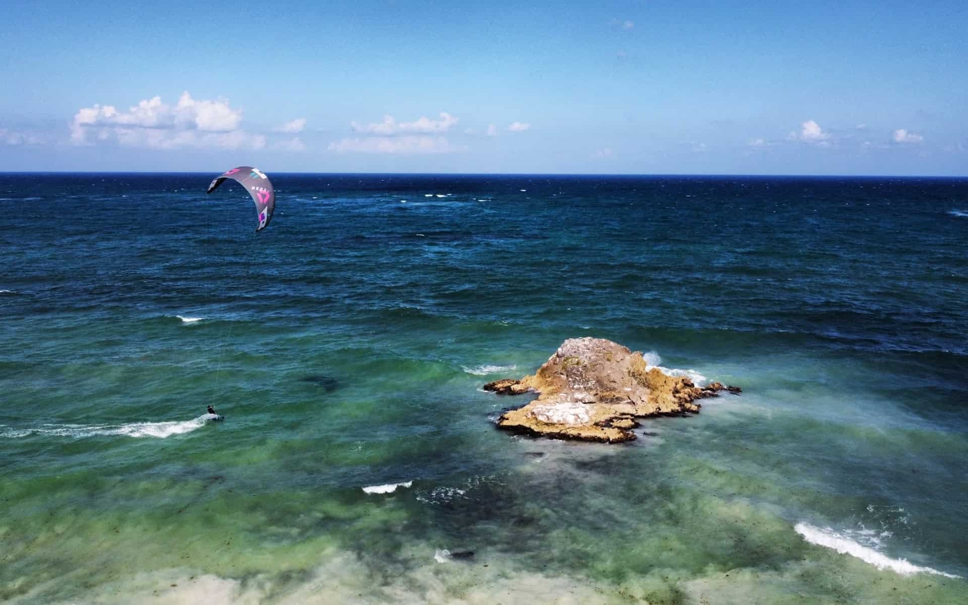 Beautiful birdview on the rock of the bay at Kitecamp Tulum